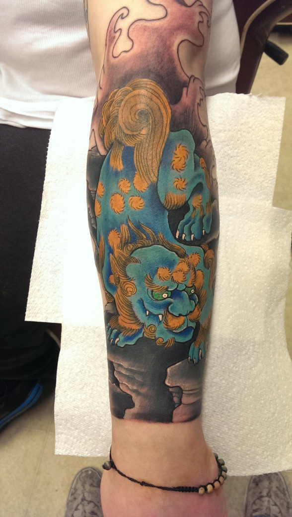 Fu Dog fore arm piece by Lee Biggs at Woodys Tattoo Studio.