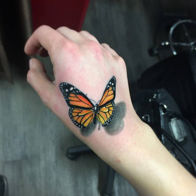 Butterfly Womens Hand Tattoo