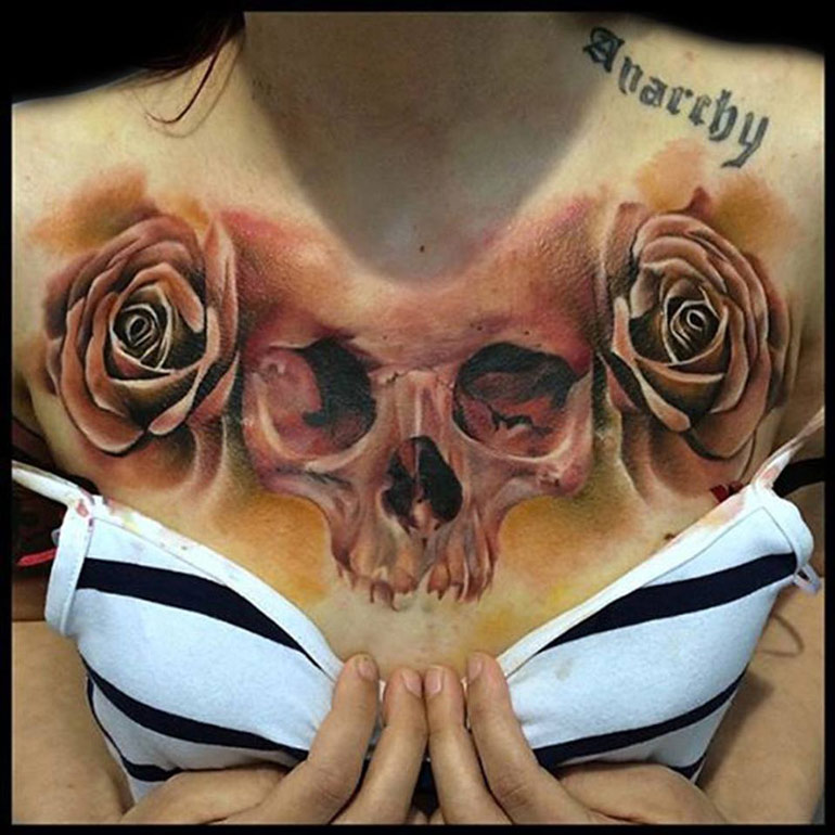 Skull roses chest tattoo design for women