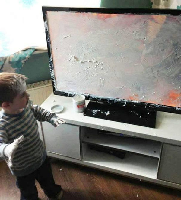 Kid Decorating The TV