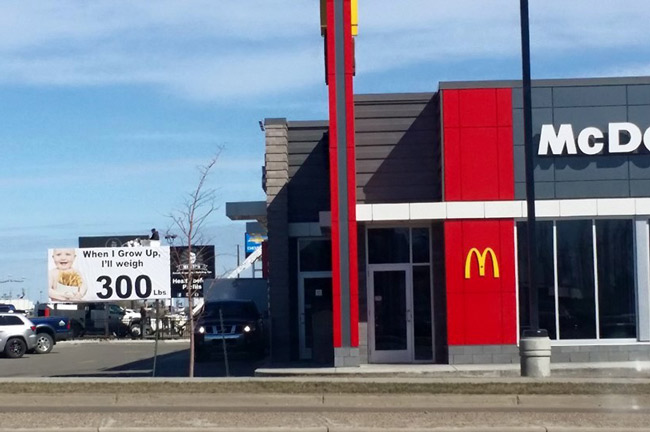 Note to McDonalds - Don't piss off the sign company next door.