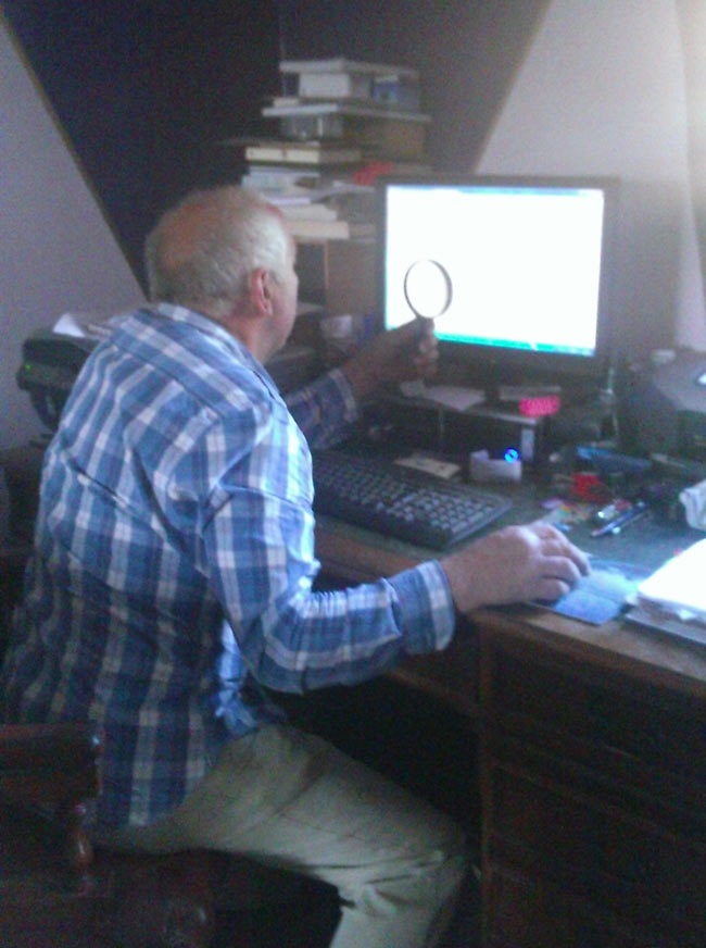 My step dad looking at maps on the pc. I did eventually tell him you could zoom in...