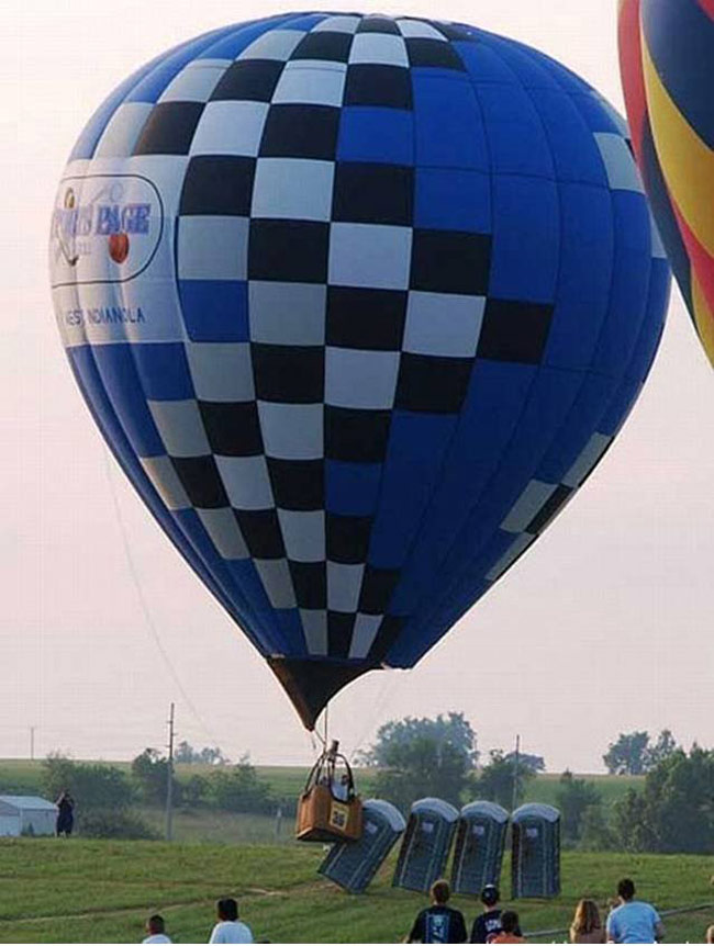 Hot air balloon knocking over portable toilets