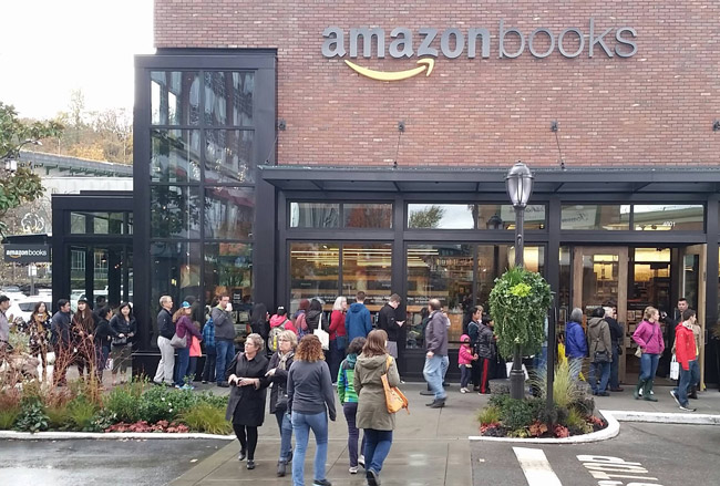 People lined up to get into the Amazon Book Store... the online book store that killed brick-n-mortar book stores