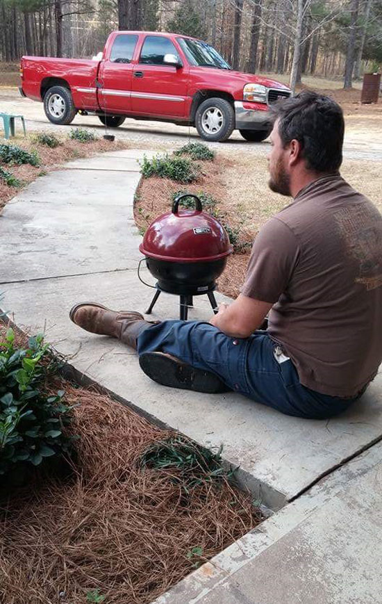 My buddy's good grill broke. This is him grilling hotdogs