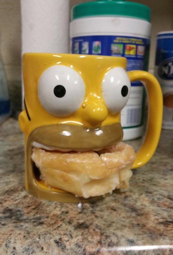 My coworker's coffee mug holds a donut
