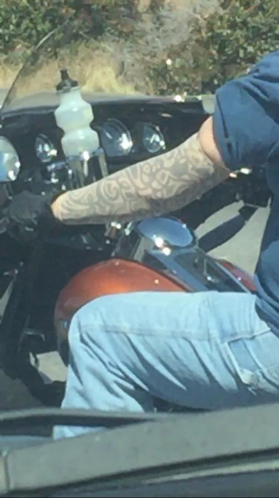 Seen on the way to work. Guy on his Harley wearing fake tattoo sleeves