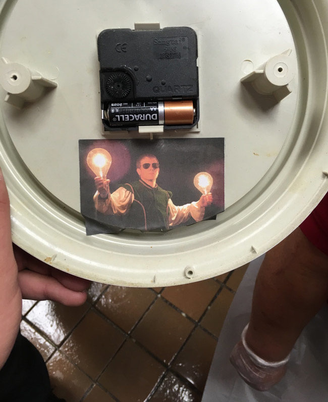 A co-worker posted pictures of himself in random places when he quit. This is the back of a clock, and he quit 2 years ago