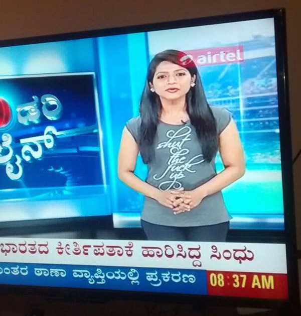 Local Indian TV news anchor forgets to check her t shirt before going on show