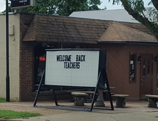 Back to school sign at local bar