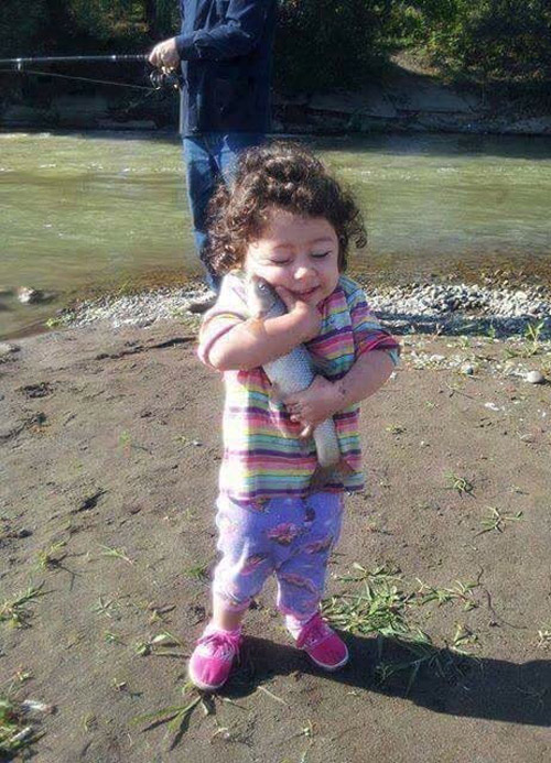 Be as happy as this kid hugging a fish