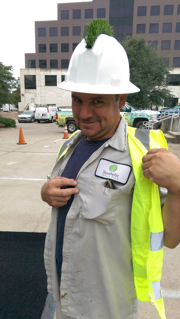 Worker who installs AstroTurf gave himself a fake grass mohawk on his hardhat