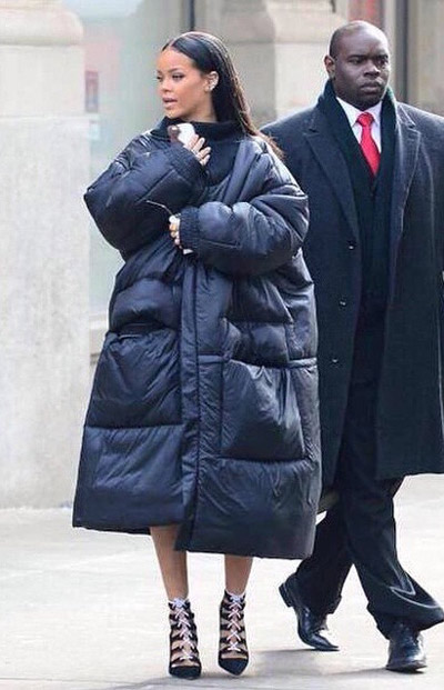 Rihanna looks like two small people, one on top of the other, trying to look older