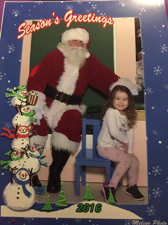 My daughter wasn't 100% sure about Santa, but still wanted a picture with him