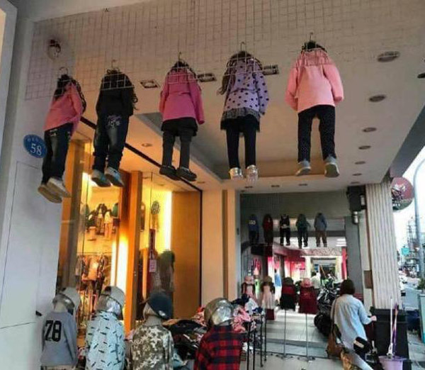 Mannequins hung up in a kid's clothing store