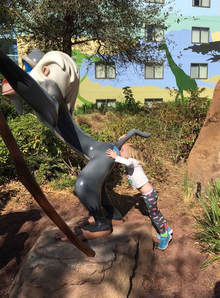 At Disney, daughter said "Mom take a picture of me giving Rafiki a kiss"
