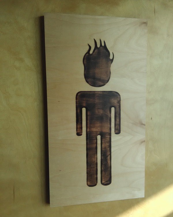 I'm proud to see a gender inclusive restroom sign. This one even accepts people who identify as Ghost Rider