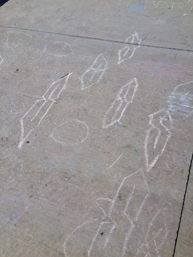 On an elementary school sidewalk, mysterious symbols from ancient times have appeared
