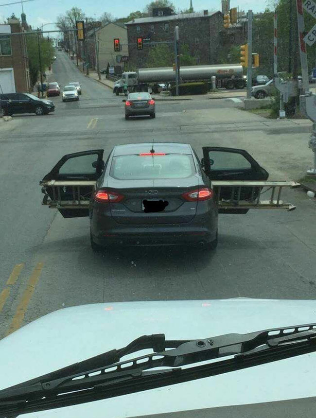 Transporting a ladder in the back seat of a sedan. Love me some Norristown, PA