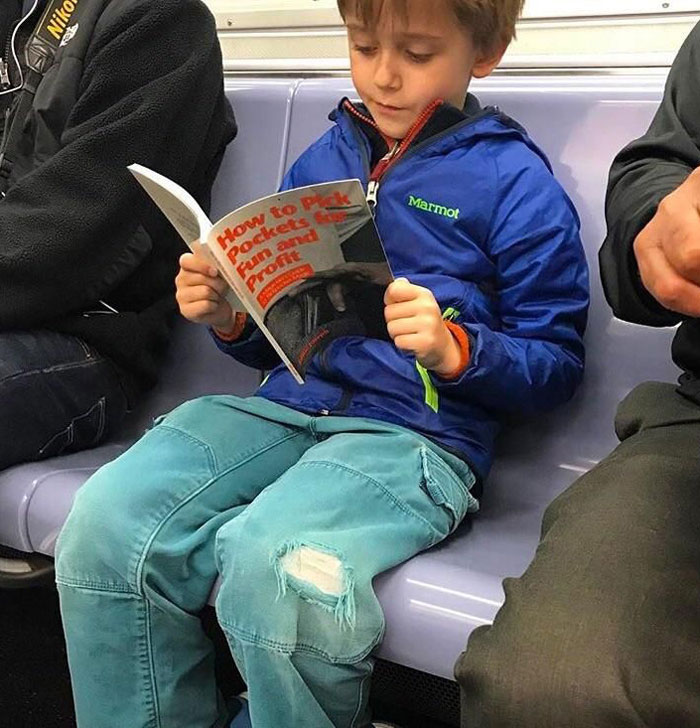 When your kid finally starts reading a book on subway rides instead of looking at his phone the whole time