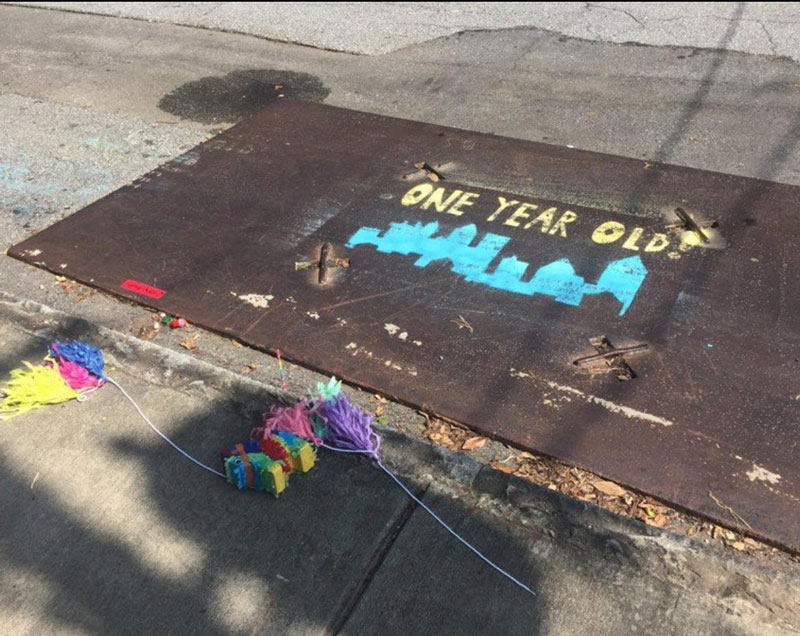 A couple in Atlanta threw a birthday party for this metal street plate