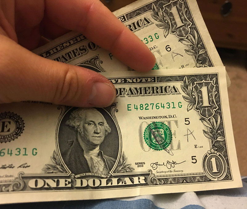 My kid marked all of my one dollar bills to see if the tooth fairy is fake