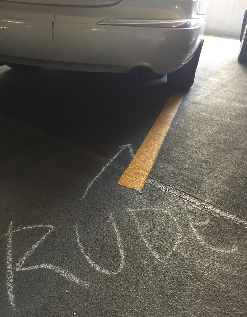 Somebody is going around our parking garage doing this to people who park on or over the line.