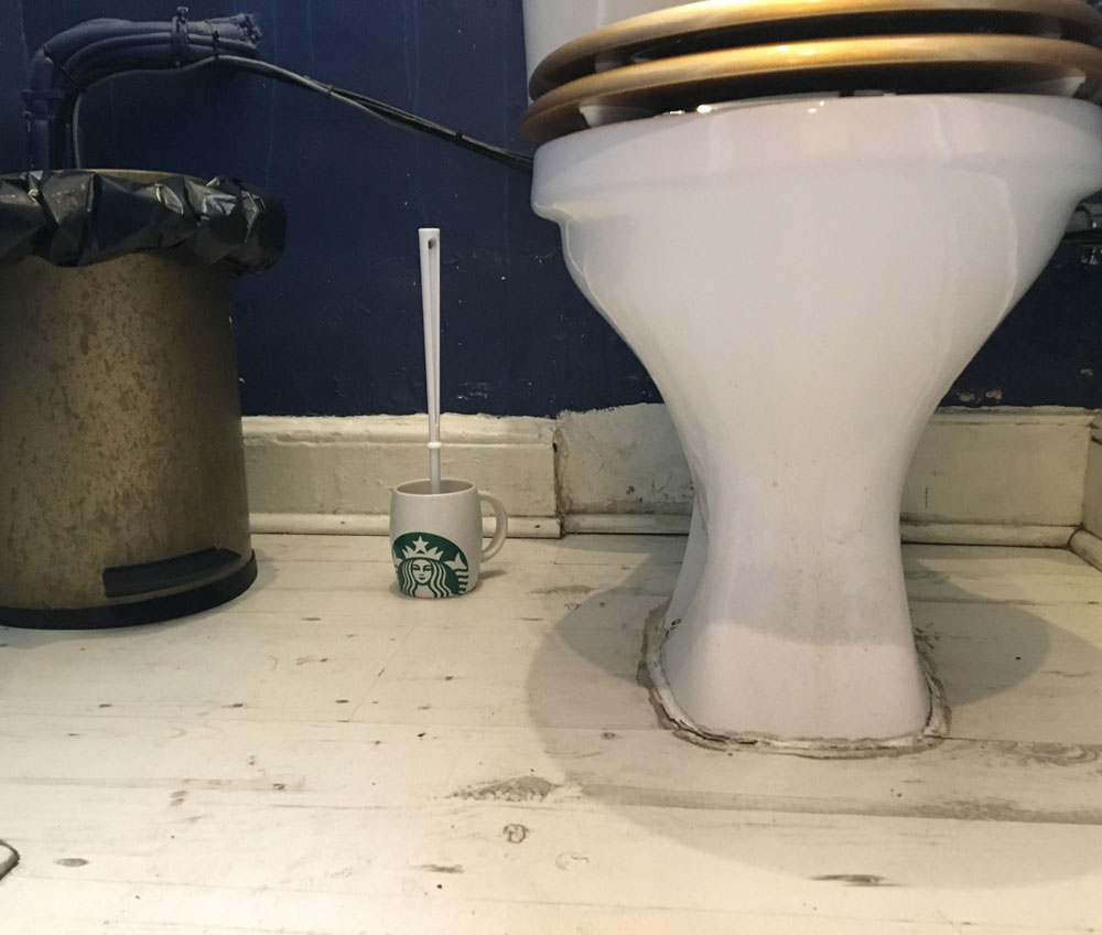 My local independent coffee shop uses a Starbucks mug for its toilet brush holder