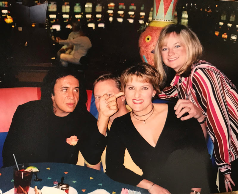 My Dad once ran into Gene Simmons of KISS in Las Vegas and asked him if he could get a photo taken wit my parents. He said sure, and as soon as the photo was taken, Gene stuck his finger in my mom’s ear while also covering up my Dad’s face