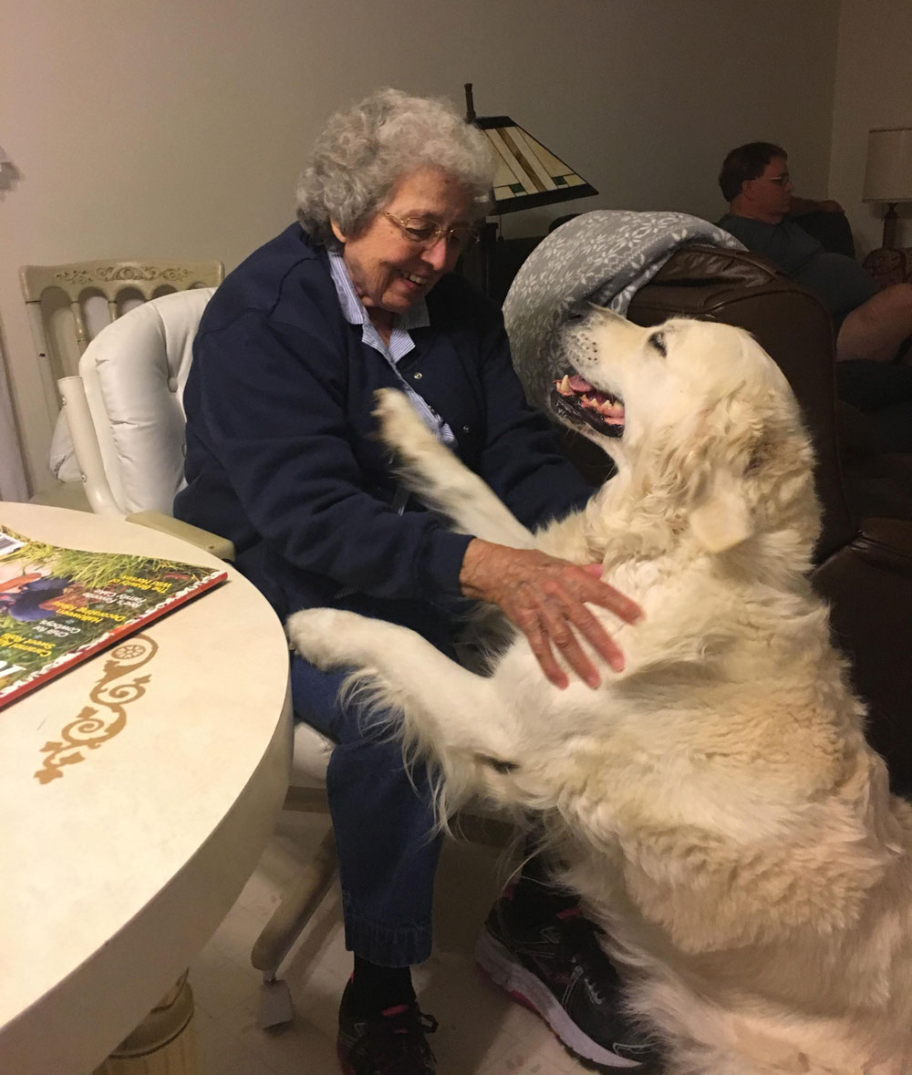 Grandma and her dog having a moment