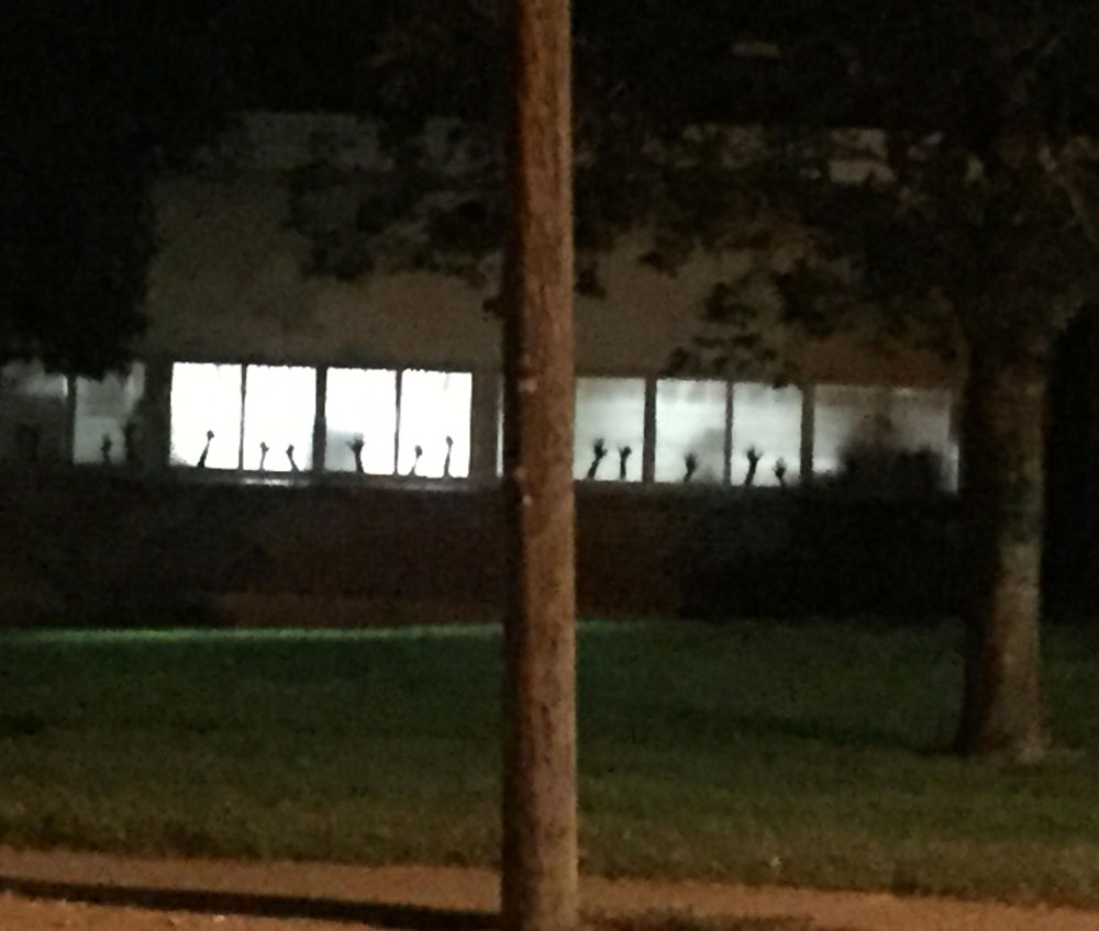 Kindergarten teacher had students trace their hands for the window...creepier than intended
