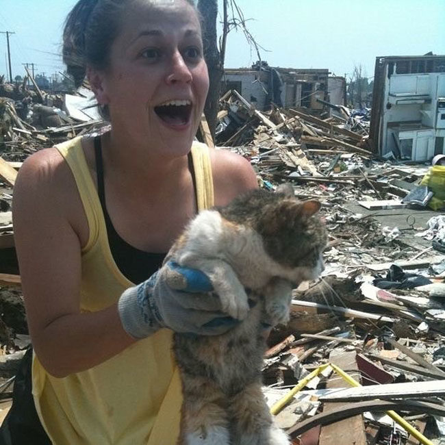 Pure joy after an earthquake...finding her cat safe!