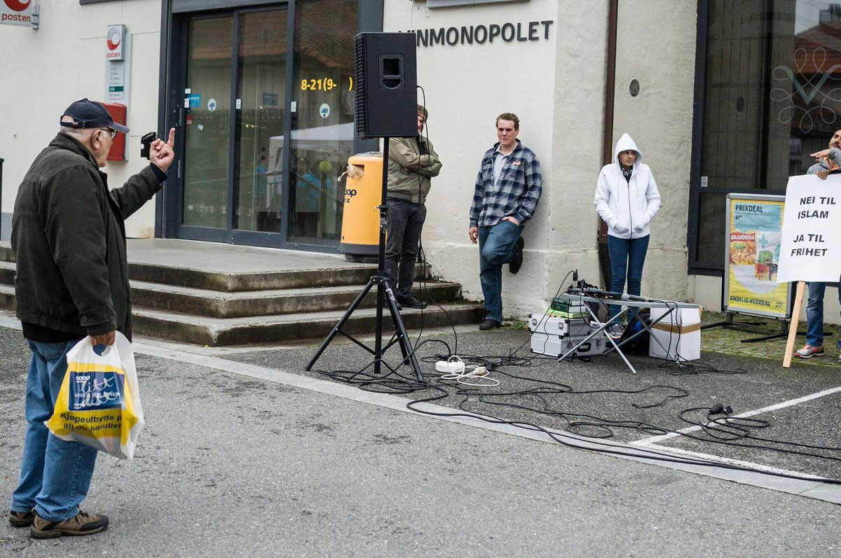 Man passing an attempted hate rally, Norway