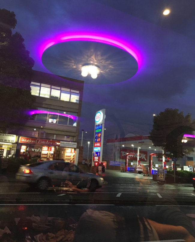 Our restaurant's lights reflected off their window looks like the aliens have arrived