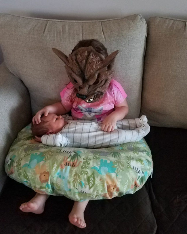 This is how my 2.5 year old niece insists on holding her new baby brother