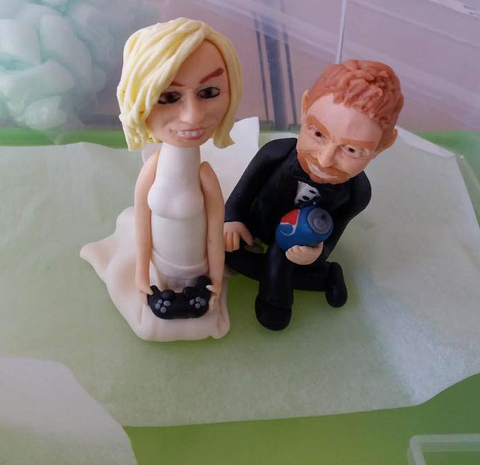 The baker wouldn't send us a picture of the cake topper until the day of the wedding... We soon found out why