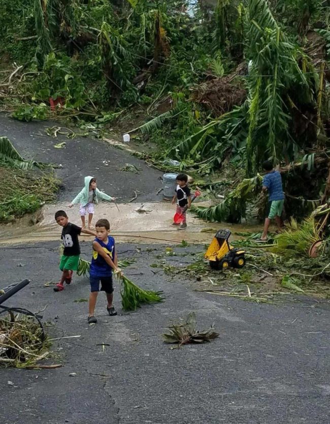 Kids clearing up the roads with their toys in Puerto Rico. They are doing what they can and that's awesome