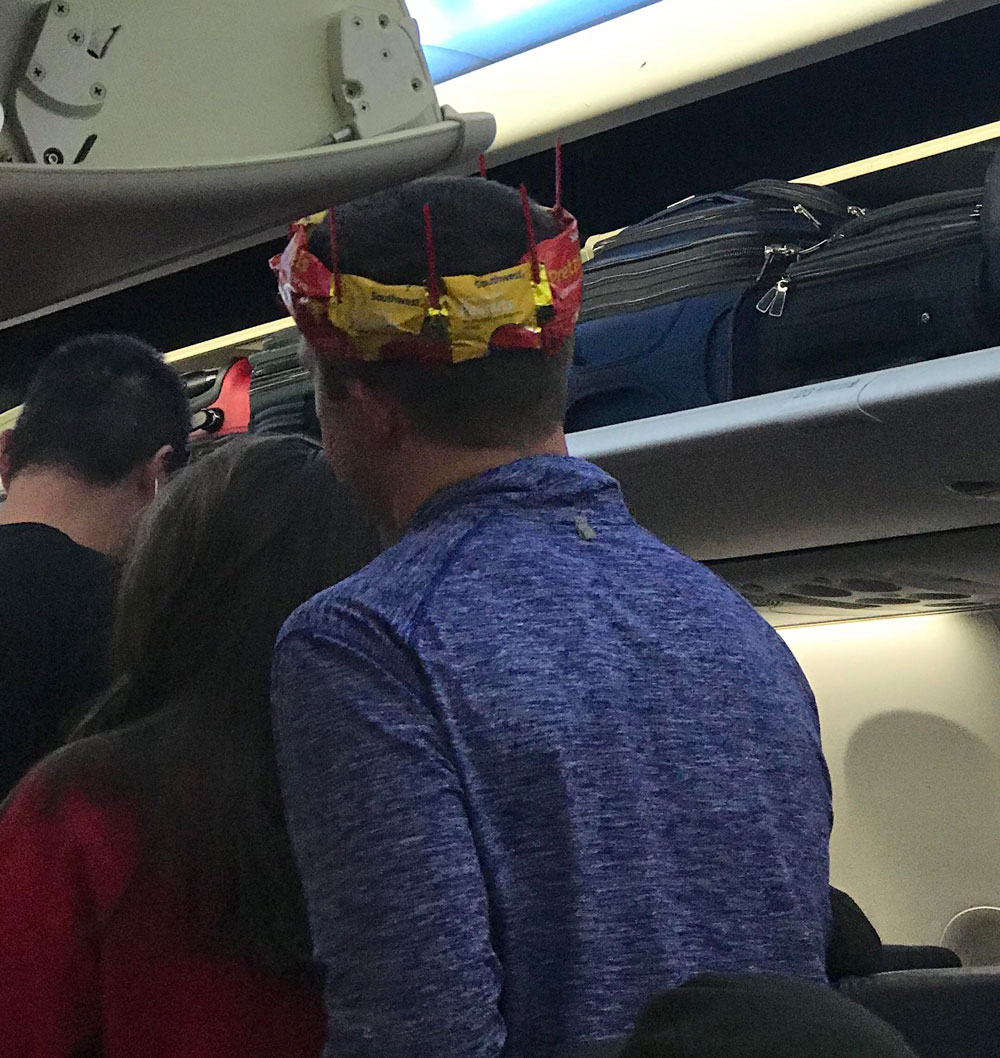 Today on my flight it was a passengers birthday, so a flight attendant made him a crown out of peanut bags and those little swords that they put in cocktail drinks