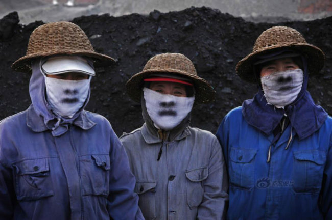 Three women from China work in a mine and show their hard work on masks