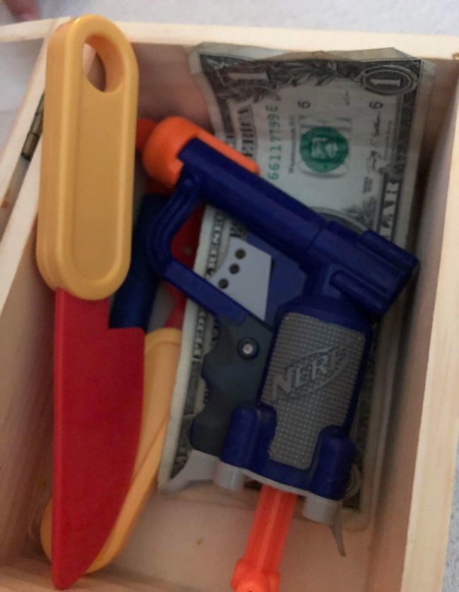 Found out my three year old daughter keeps a box with a knife, a gun, and some cash. Should I be worried?