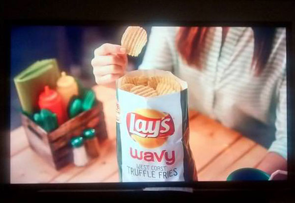 Nice try, Lay's. No one has ever seen a full bag of potato chips - your ad is false