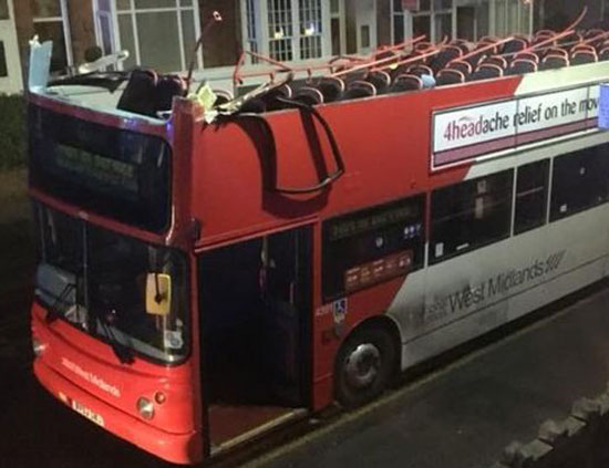 Bus got scalped by a bridge. Advert on the side is appropriate