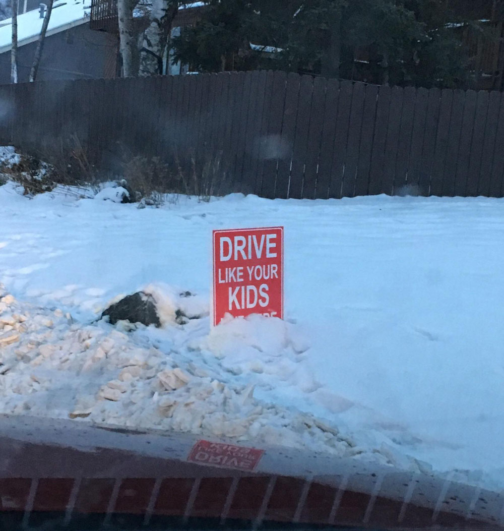 "Drive like your kids live here" sign got partially covered