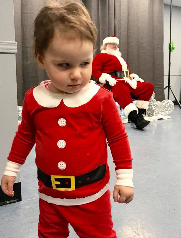 We dressed up our 18 month old daughter to see Santa. She was not pleased