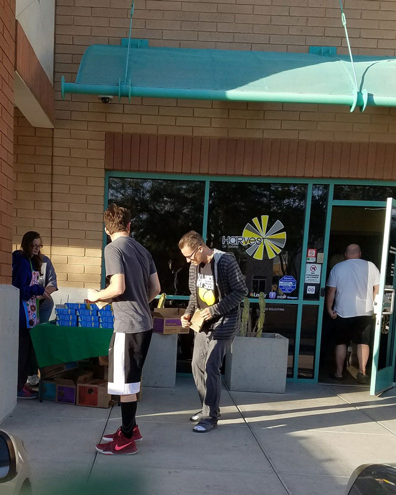 Girl Scouts selling cookies outside a dispensary
