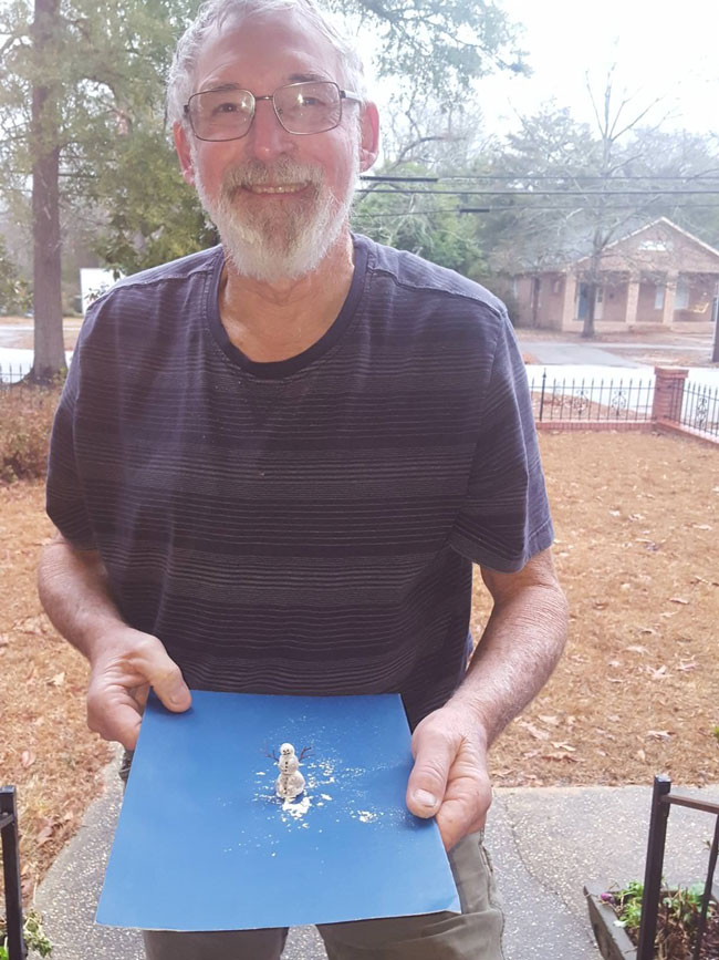 It snowed today in South Carolina. My Papa made a snowman!