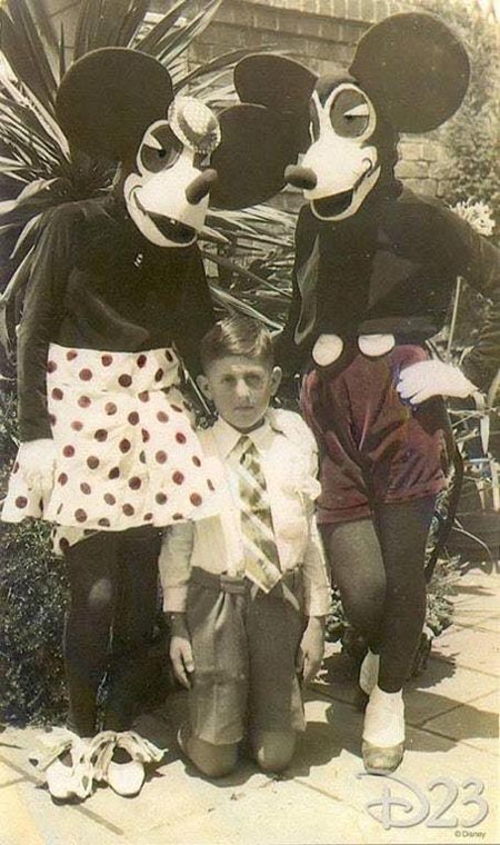 A child poses with the first Mickey and Minnie Mouse costumes in 1939. Walt Disney was very unhappy with the original costumes, and said it looked like some kind of ransom demand