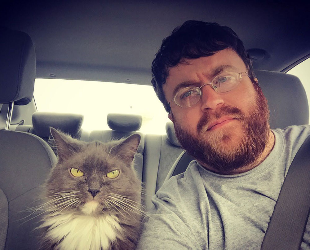 My cat and I enjoy driving around town and disapproving of everyone we see
