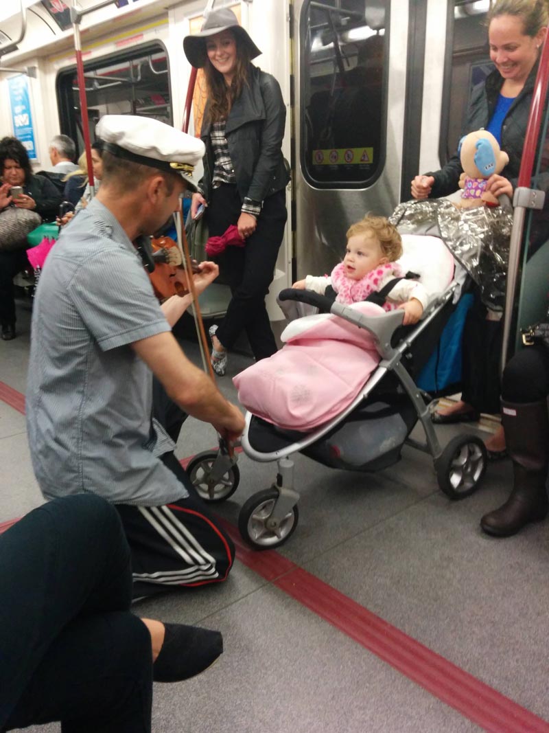 This guy spent his subway ride playing his violin for a baby because she was crying