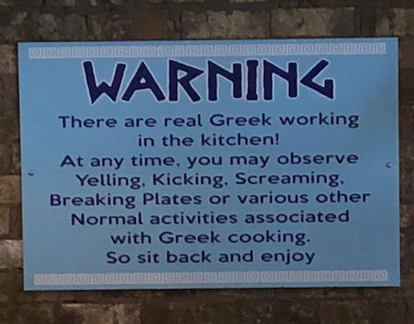 This sign is hanging in the dining area of our local Greek restaurant
